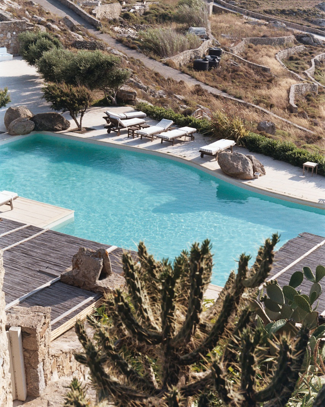 Panoramic pool view at a private villa in Mykonos, Greece, capturing the essence of summer