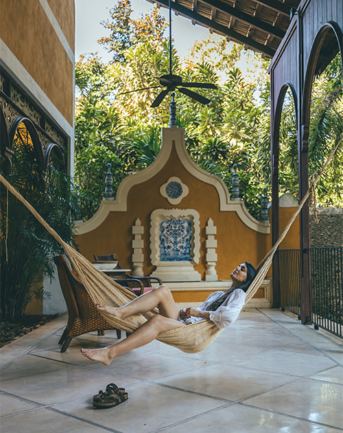 Relaxed ambiance in a hammock at Hacienda San Antonio Millet's courtyard