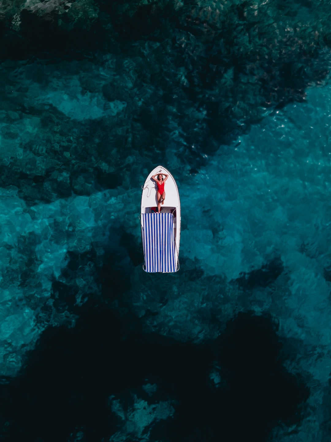 Aerial View of a Boat Sailing in the Summer Seas of Croatia