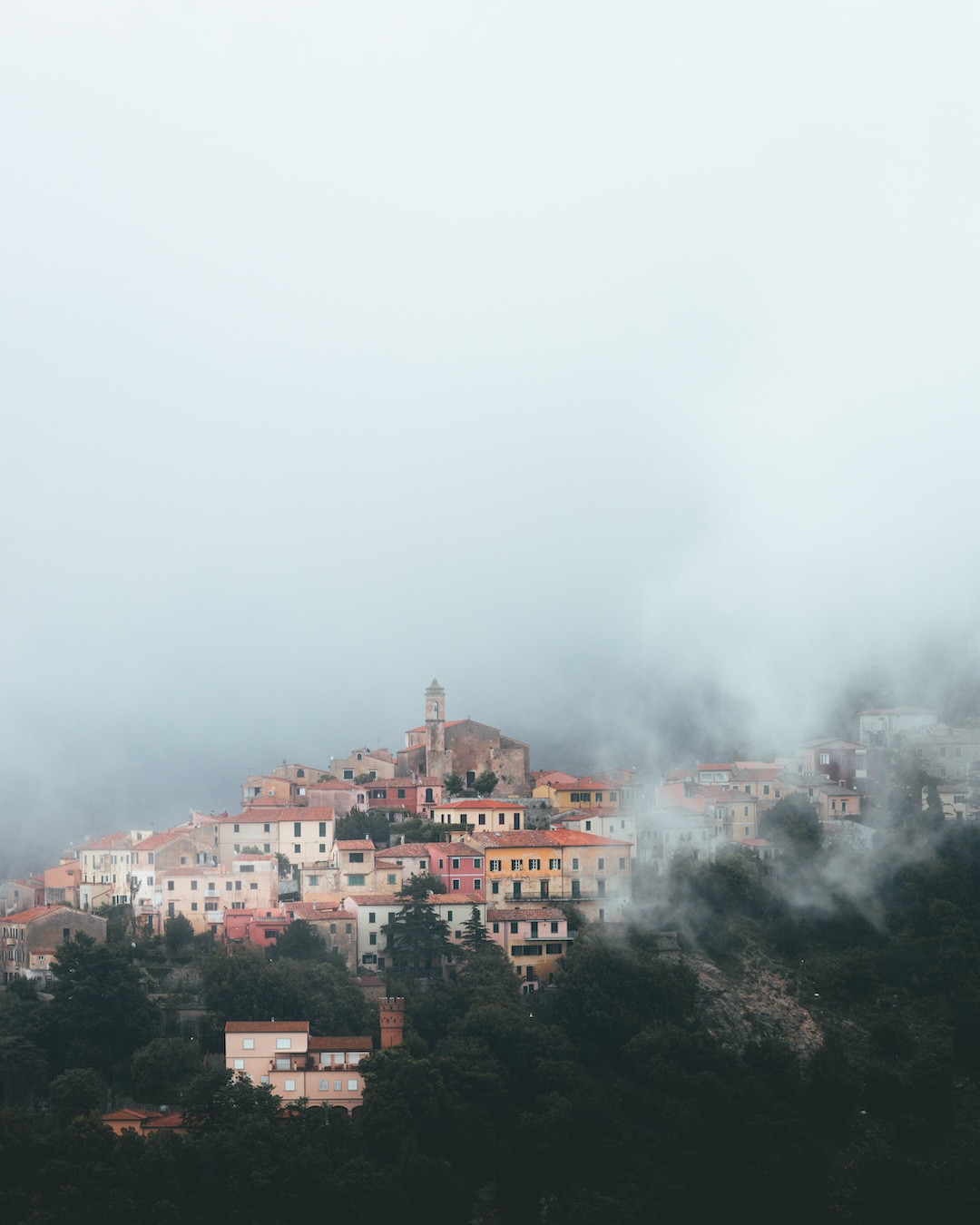 Hilltop town of Marciana surrounded by fog on Isola Elba