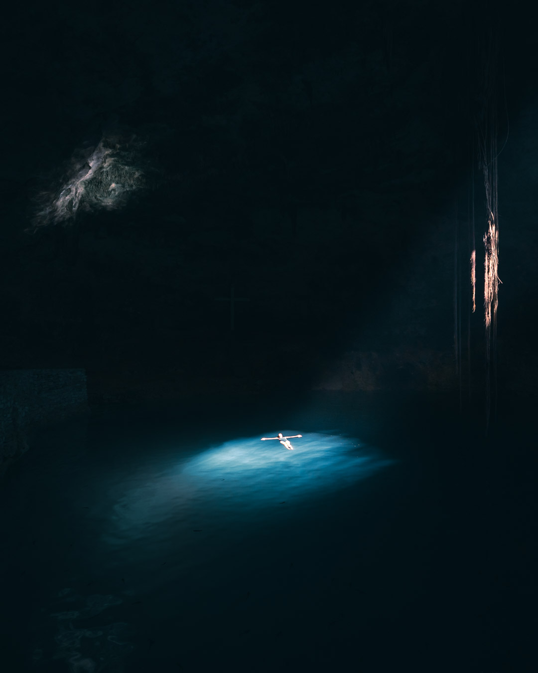 Tranquil Cenote Hubiku in Mexico with a Lone Swimmer