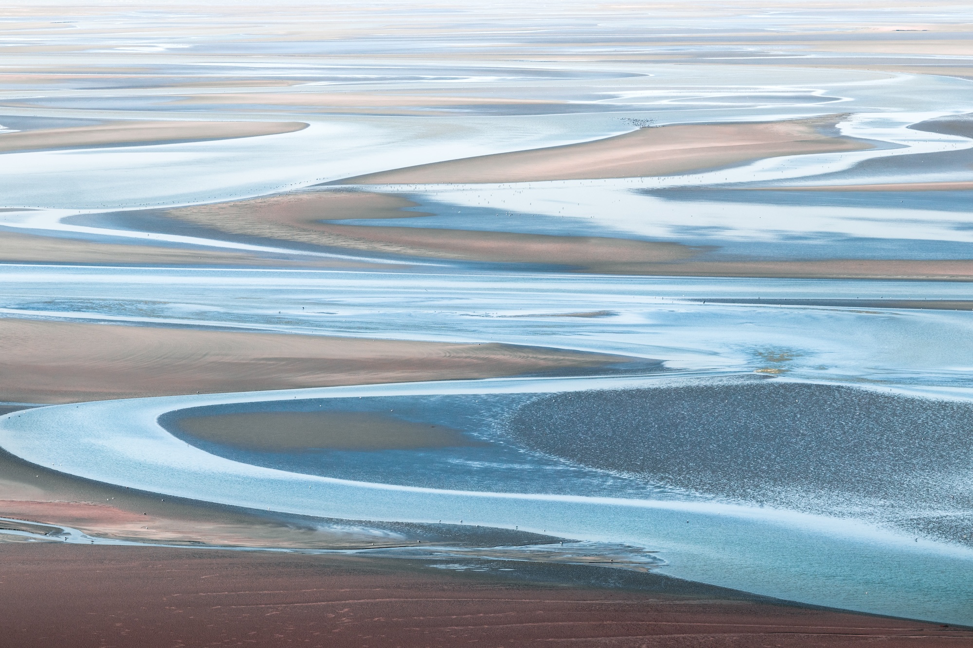 Intricate Earth Patterns of Tides at Mont Saint Michel, France